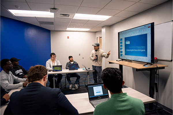 Dr. David Zeng teaching AI in Organizations to DSU students. 